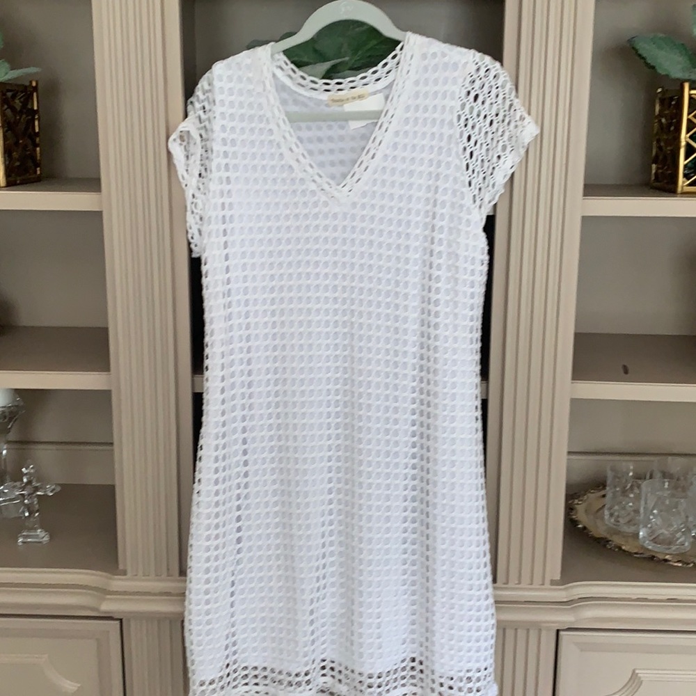 Figure flattering summer white knit dress.
